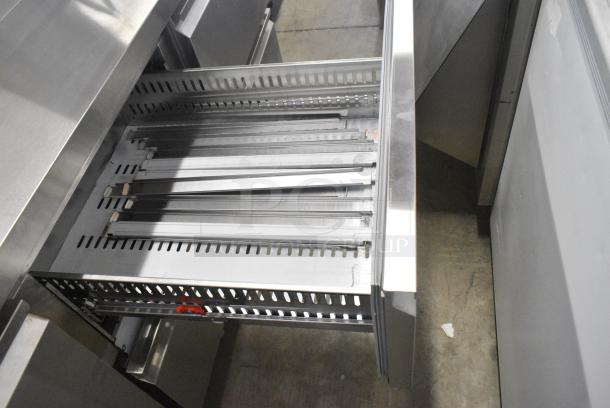 BRAND NEW SCRATCH AND DENT! 2024 Avantco 178SSPPT3 Stainless Steel Commercial 94" 3 Door Refrigerated Pizza Prep Table w/ 4 Drawers and 1 Door on Commercial Casters. 115 Volts, 1 Phase. Tested and Working! - Image 7 of 14