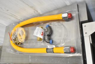 BRAND NEW SCRATCH AND DENT! Regency 600GKM3448 48" Mobile Gas Connector Hose Kit with 2 Elbows, Full Port Valve, Restraining Device, and Quick Disconnect - 3/4"