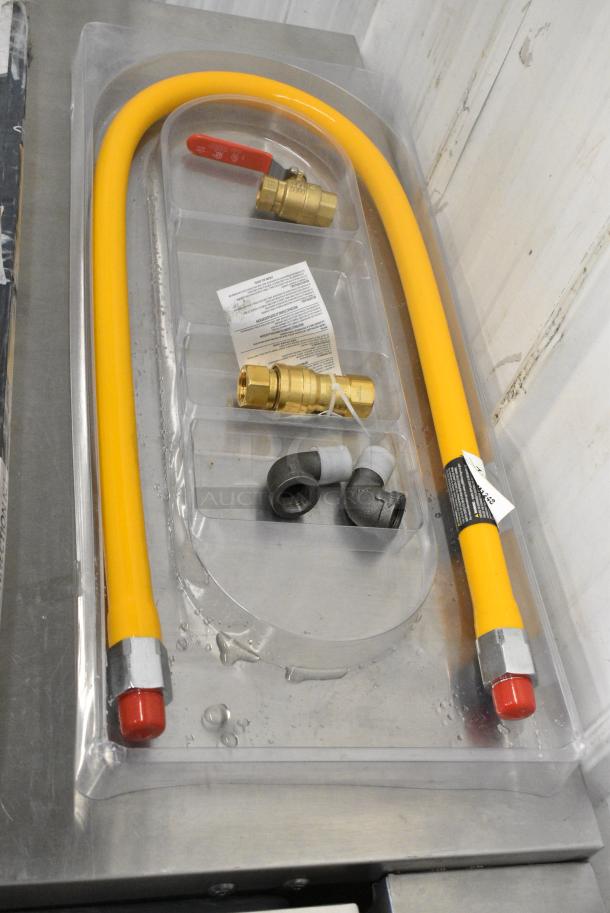 BRAND NEW SCRATCH AND DENT! Regency 600GKM1248 48" Mobile Gas Connector Hose Kit with 2 Elbows, Full Port Valve, Restraining Device, and Quick Disconnect - 1/2" - Image 1 of 4