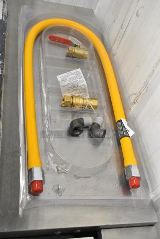 BRAND NEW SCRATCH AND DENT! Regency 600GKM1248 48" Mobile Gas Connector Hose Kit with 2 Elbows, Full Port Valve, Restraining Device, and Quick Disconnect - 1/2"