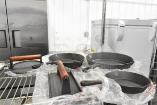 5 BRAND NEW SCRATCH AND DENT! Items Including 3 Cast Iron Skillets and 2 Bacon Presses. 5 Times Your Bid!