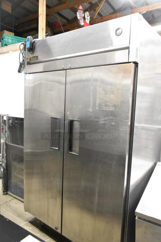 True TG2R-2S Stainless Steel Commercial 2 Door Reach In Cooler w/ Poly Coated Racks on Commercial Casters. 115 Volts, 1 Phase. Tested and Working!