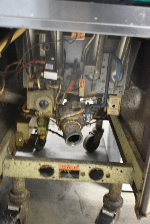 Pitco Frialator SG14R Stainless Steel Commercial Floor Style Natural Gas Powered Deep Fat Fryer w/ 2 Metal Fry Baskets on Commercial Casters. 122,000 BTU. - Image 7 of 8
