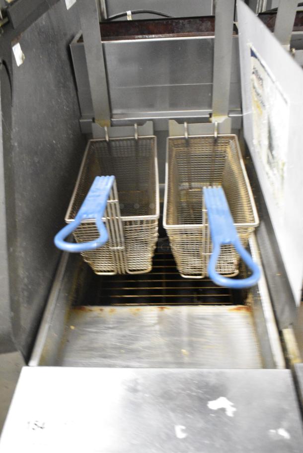 Pitco Frialator SG14R Stainless Steel Commercial Floor Style Natural Gas Powered Deep Fat Fryer w/ 2 Metal Fry Baskets on Commercial Casters. 122,000 BTU. - Image 5 of 8