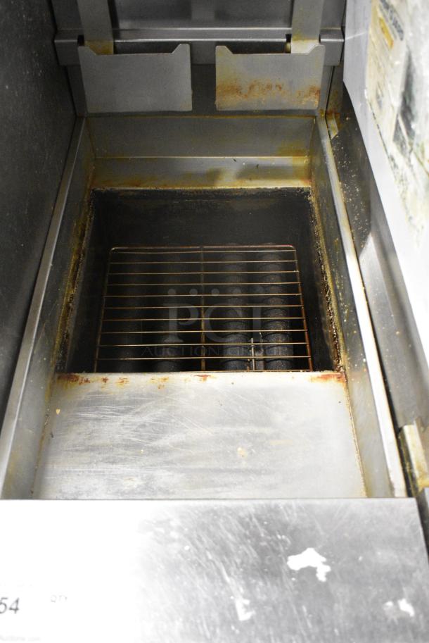 Pitco Frialator SG14R Stainless Steel Commercial Floor Style Natural Gas Powered Deep Fat Fryer w/ 2 Metal Fry Baskets on Commercial Casters. 122,000 BTU. - Image 6 of 8
