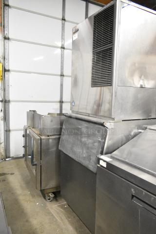 Hoshizaki KM-901MAH Stainless Steel Commercial Ice Machine on Commercial Ice Bin. 208-230 Volts, 1 Phase.