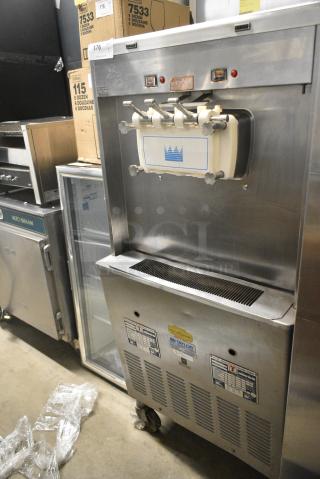 Taylor 339-33 Stainless Steel Commercial Floor Style Water Cooled 2 Flavor w/ Twist Soft Serve Ice Cream Machine on Commercial Casters. 208-230 Volts, 3 Phase.