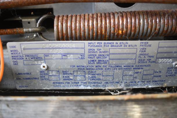 Garland M46R Stainless Steel Commercial Natural Gas Powered Flat Top Griddle w/ Oven and Back Splash. - Image 6 of 6