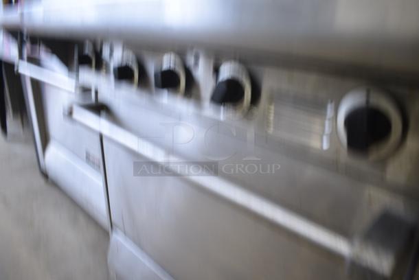 Garland M47R Stainless Steel Commercial Natural Gas Powered Flat Top Griddle w/ Oven and Back Splash. - Image 3 of 7