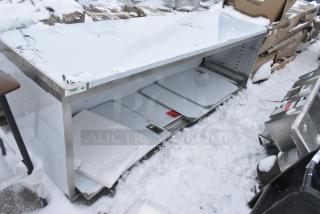 BRAND NEW SCRATCH AND DENT! Regency 600EBT3096D 30" x 96" 16 Gauge Type 304 Stainless Steel Enclosed Base Table with Sliding Doors and Adjustable Midshelf