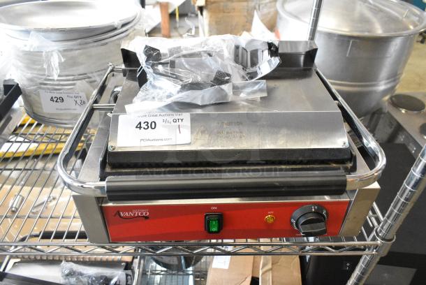 BRAND NEW SCRATCH AND DENT! 2024 Avantco PG200GS Commercial Panini Sandwich Grill with Grooved Top and Smooth Bottom Plates, and 13 3/8" x 8 3/4" Cooking Surface. 120 Volts, 1 Phase. Tested and Working! - Image 1 of 10