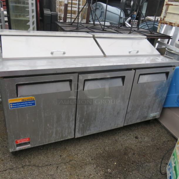 One Turbo Air 3 Door Refrigerated Prep Table With 3 Racks On Casters. Model# MST-72. 115 Volt. 72X30X43. $4576.87 - Image 1 of 2
