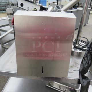 One Stainless Steel Napkin Dispenser.
