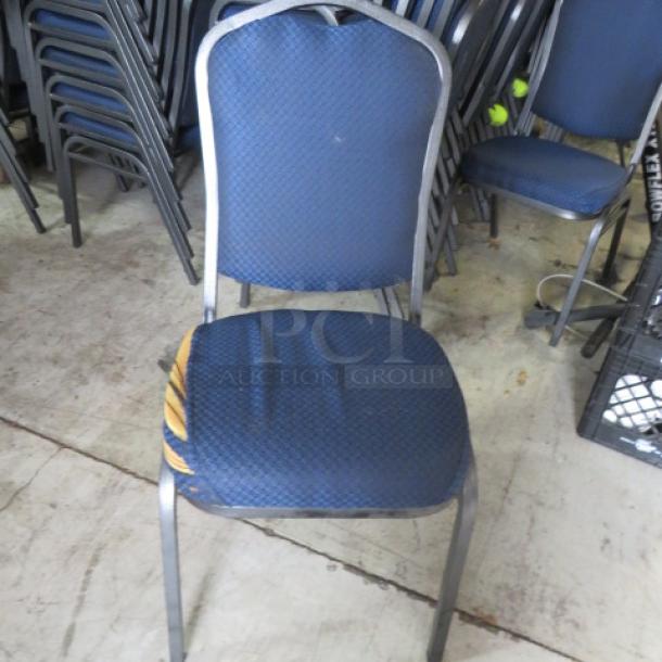 Black Metal Stack Chair With Blue Cushioned Seat And Back. Half Have Some Flaws. See Pics. 10XBID - Image 1 of 3