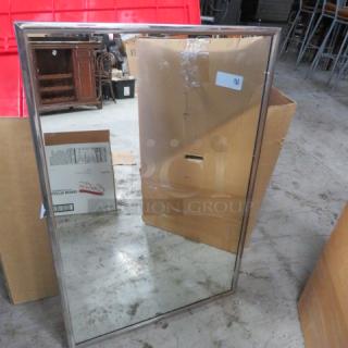 One Stainless Steel Framed Mirror. 36X24