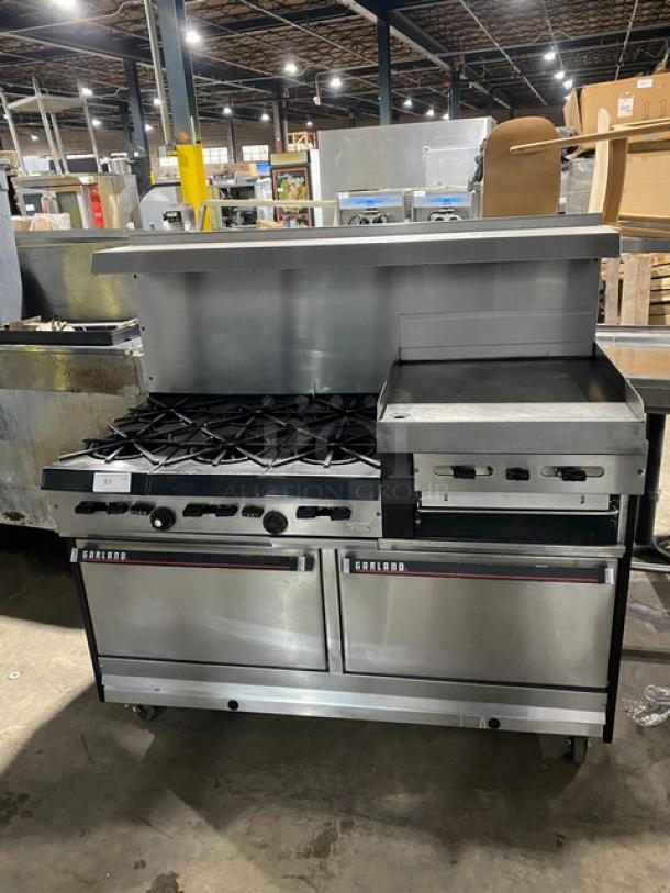 WOW! Garland Commercial Stainless Steel Natural Gas Powered 6 Burner/Raised Flat Griddle Split Top Range & Double Oven Combo! With Built-In Broiler/Cheese Melter! With Back Splash & Overhead Salamander Shelf! With Wired Oven Racks! On Casters! Working When Removed! - Image 1 of 10