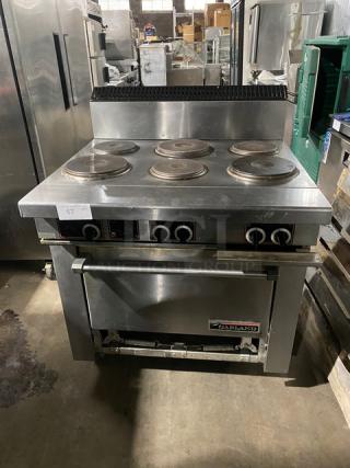 Garland Commercial Stainless Steel Electric Powered 6 Sealed Burner Range/Oven Combo! With Back Splash! With Wire Oven Rack! On Casters!