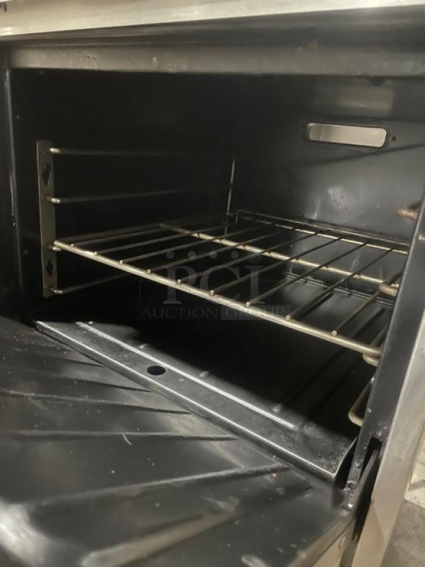 Garland Commercial Stainless Steel Natural Gas Powered 4 Burner Range/Oven Combo! With Back Splash & Overhead Salamander Shelf! With Wire Oven Rack! Model: H28 SN: 0701100159611! On Legs! - Image 7 of 10