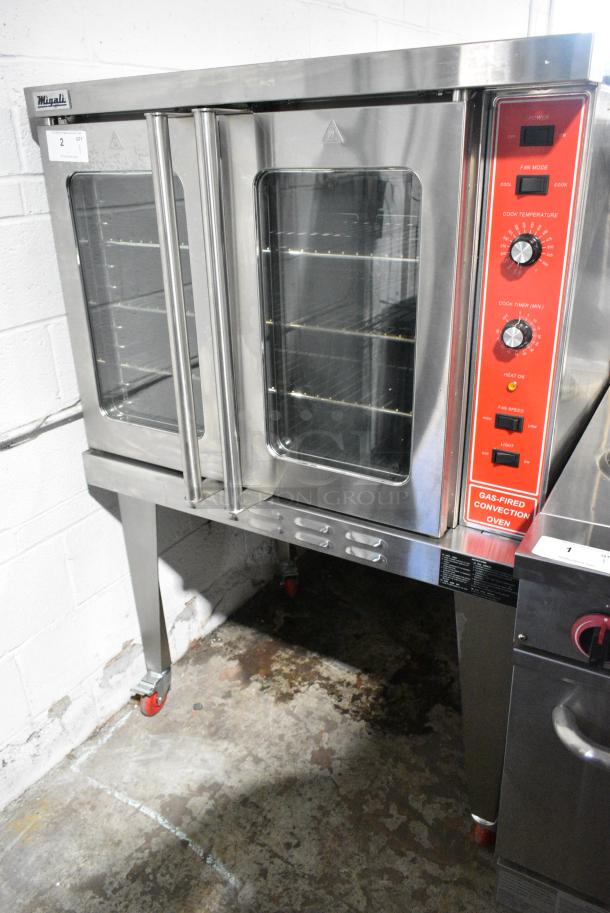 BRAND NEW SCRATCH AND DENT! Migali C-C01-SD-NG Stainless Steel Commercial Natural Gas Powered Full Size Convection Oven w/ View Through Doors, Metal Oven Racks, Thermostatic Controls and Metal Legs on Commercial Casters. - Image 2 of 8