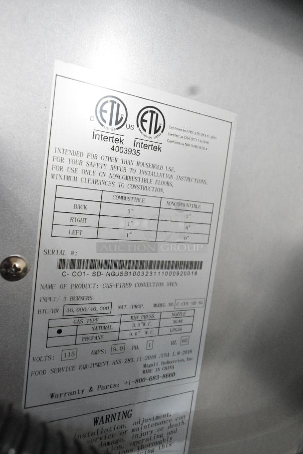 BRAND NEW SCRATCH AND DENT! Migali C-C01-SD-NG Stainless Steel Commercial Natural Gas Powered Full Size Convection Oven w/ View Through Doors, Metal Oven Racks, Thermostatic Controls and Metal Legs on Commercial Casters. - Image 7 of 8