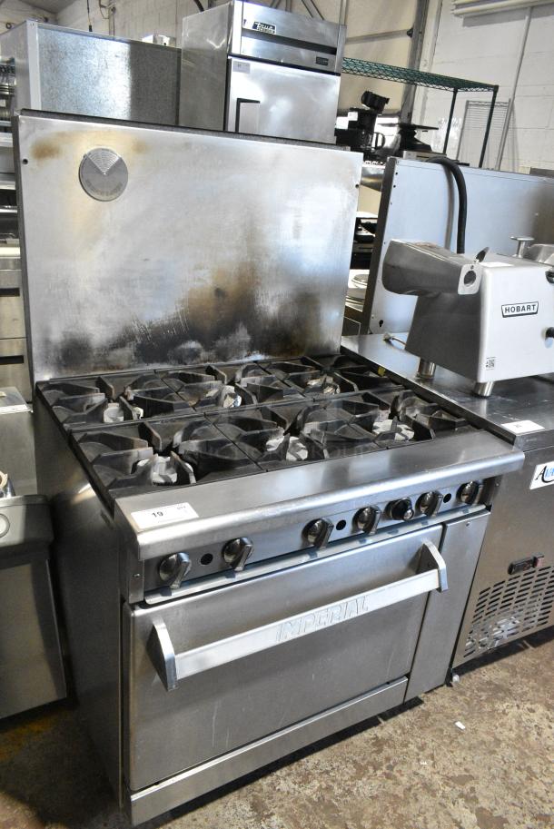 Imperial Stainless Steel Commercial Propane Gas Powered 6 Burner Range w/ Oven and Back Splash. - Image 1 of 7