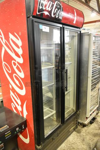 True GDM-35EM ENERGY STAR Metal Commercial 2 Door Reach In Cooler Merchandiser w/ Poly Coated Racks. 115 Volts, 1 Phase. Tested and Powers On But Does Not Get Cold