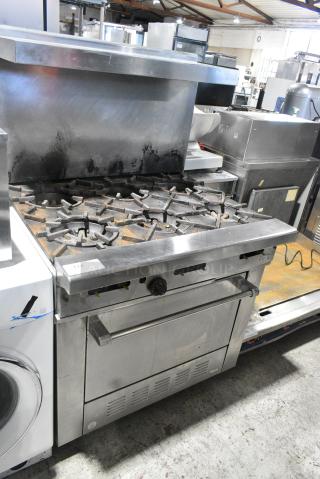 Stainless Steel Commercial Natural Gas Powered 6 Burner Range w/ Oven, Over Shelf and Back Splash.