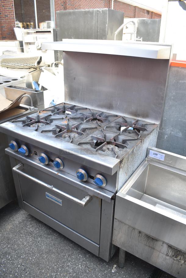 Standard Range Stainless Steel Commercial Gas Powered 6 Burner Range w/ Oven, Over Shelf and Back Splash. - Image 1 of 7