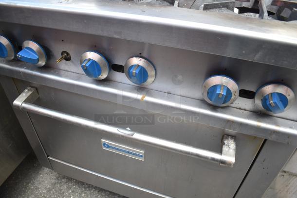 Standard Range Stainless Steel Commercial Gas Powered 6 Burner Range w/ Oven, Over Shelf and Back Splash. - Image 4 of 7