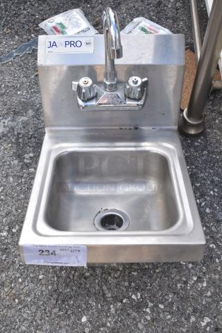 Stainless Steel Single Bay Wall Mount Sink w/ Faucet and Handles.