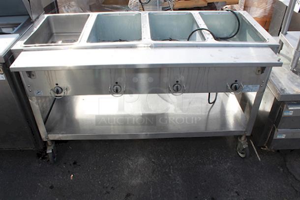 4 Well Electric Steam Table With Undershelf & 8" Deep Cutting Board, On Commercial Casters In working Order. - Image 1 of 1