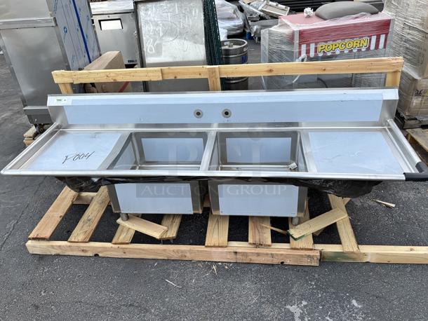 BRAND NEW SCRATCH & DENT! Regency 600S22323224 96" 16 Gauge Stainless Steel Two Compartment Sink And 2 Drainboards - 23" x 23" x 12" Bowls, 24" Right & Left Drainboards. VERY MINOR scratching/scuffing. - Image 1 of 7