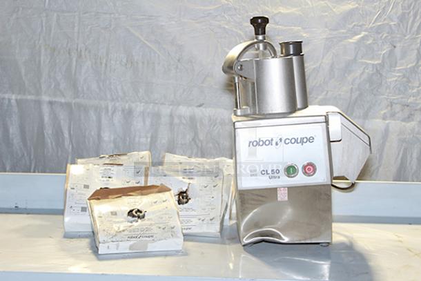 BRAND NEW SCRATCH & DENT! Robot Coupe CL50 Ultra Continuous Feed Food Processor - 1 1/2 hp With (5) Discs, Blades & Grids: (2806SW) 11/32" Grating / Shredding Disc, (28130W) 3/8" Slicing Disc, (28064W) 1/8" Slicing Disc, (28119) 3/8" Dicing Grid, (28059W) 3/16" Grating / Shredding Disc. 120 Volts 1 Phase 60 Hz - Image 1 of 8