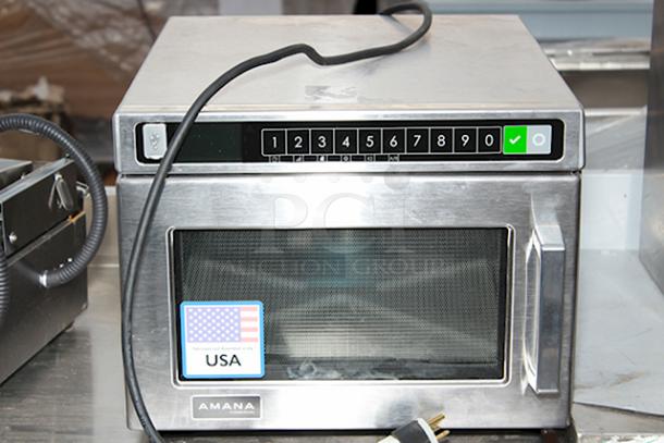 BRAND NEW SCRATCH & DENT! Amana HDC1815 Heavy-Duty Stainless Steel Commercial Microwave with Push Button Controls - 208/240V, 1800W, 14.4 Amps, 1 Phase, 60 Hz. S/N: 2410110964. Unit is dented on the sides. - Image 1 of 6
