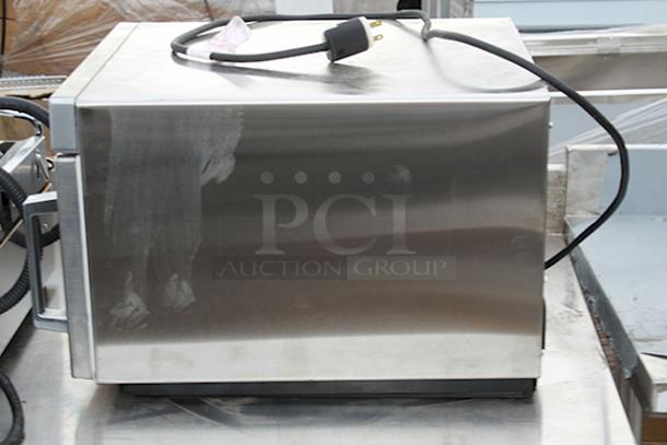 BRAND NEW SCRATCH & DENT! Amana HDC1815 Heavy-Duty Stainless Steel Commercial Microwave with Push Button Controls - 208/240V, 1800W, 14.4 Amps, 1 Phase, 60 Hz. S/N: 2410110964. Unit is dented on the sides. - Image 4 of 6