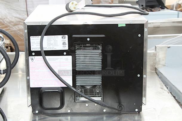 BRAND NEW SCRATCH & DENT! Amana HDC1815 Heavy-Duty Stainless Steel Commercial Microwave with Push Button Controls - 208/240V, 1800W, 14.4 Amps, 1 Phase, 60 Hz. S/N: 2410110964. Unit is dented on the sides. - Image 5 of 6