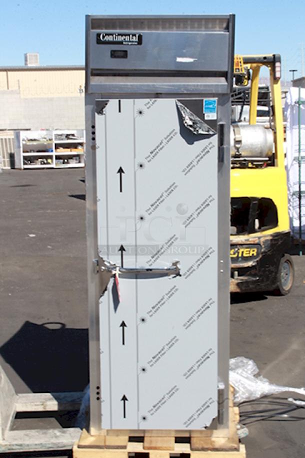 BRAND NEW SCRATCH & DENT! Continental Refrigerator 1R-N 26" Solid Door Reach-In Refrigerator, 115 Volts, 1 Phase, 60Hz. On Commercial Casters. In working Order. Keys to lock are missing. S/N: 16494690. Unit is dented. See photos. - Image 1 of 6