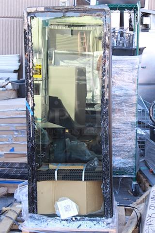 BRAND NEW SCRATCH & DENT! True CVM-13-HC~EGC01 24 7/8" Black Refrigerated Contemporary Glass Door Merchandiser with LED Lighting - 64" Tall 115 Volts	2.5 Amps	1 Phase	60 Hz S/N: 10771955-1. Outer Glass Pane Is Broken.