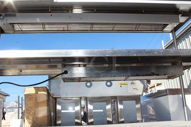 Stainless Steel Enclosed Base Commercial Workstation With Adjustable Mid-Shelf, Double Overshelf, Order TIcket Rail, (2) Nemco Strip Warmers and Delifield 225 6 Gallon Drop In Freezer. In Working Order. - Image 7 of 9