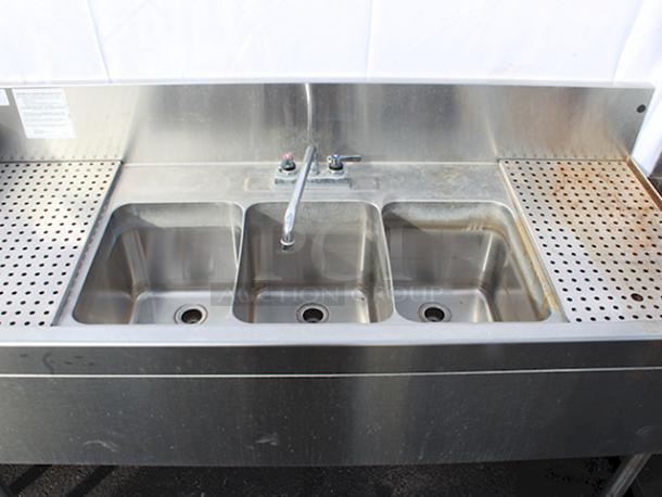 DEAL!! Glastender TSB-60-S Underbar Three Compartment Sink Unit With Drainboards, 60"x24". Sink Compartment Dimensions: 11" W X 14" Front-To-Back X 10-1/4" Deep, 12" Drainboards On Left & Right With Removable  Perforated Inserts & Deck Mount Faucet. STAINLESS STEEL CONSTRUCTION & STAINLESS STEEL LEGS!! S/N: 262843 - Image 4 of 7