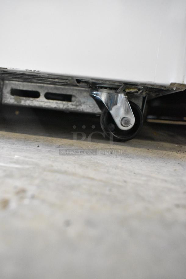 BRAND NEW SCRATCH AND DENT! Beverage Air NC-60HC-1-W 60" Curved Lid Novelty Display Freezer on Commercial Casters. 120 Volts, 1 Phase. Tested and Working! - Image 4 of 9
