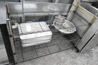 3 Tier Wire Shelving Unit w/ Contents Including Metal Baking Pans. BUYER MUST DISMANTLE. PCI CANNOT DISMANTLE FOR SHIPPING. PLEASE CONSIDER FREIGHT CHARGES.