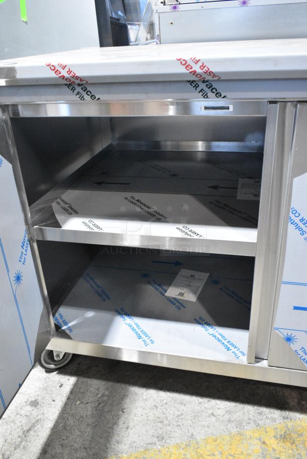 BRAND NEW SCRATCH AND DENT! Stainless Steel Counter w/ 2 Doors and Under Shelves on Commercial Casters. - Image 4 of 9