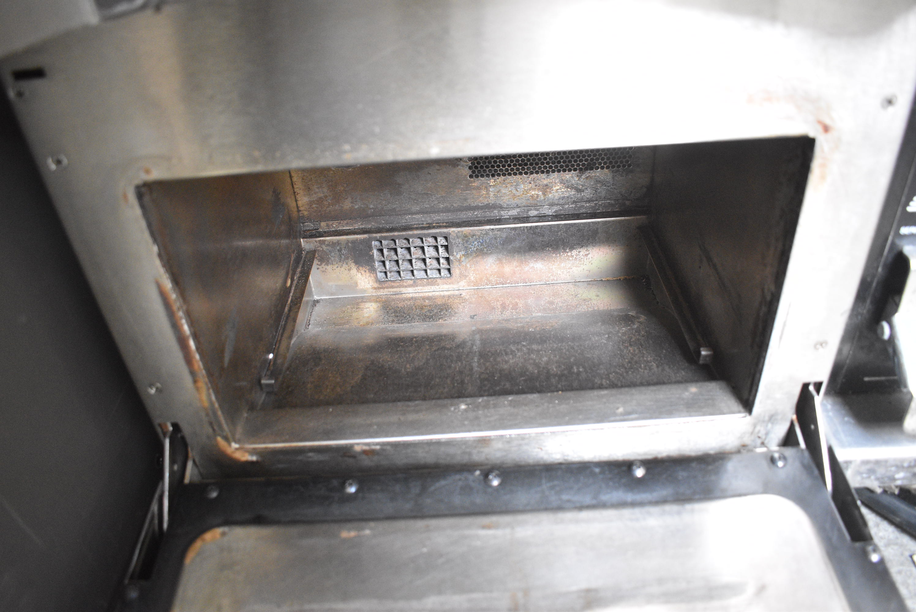 Interior of rapid-cook oven showing door latch interlock location in top left