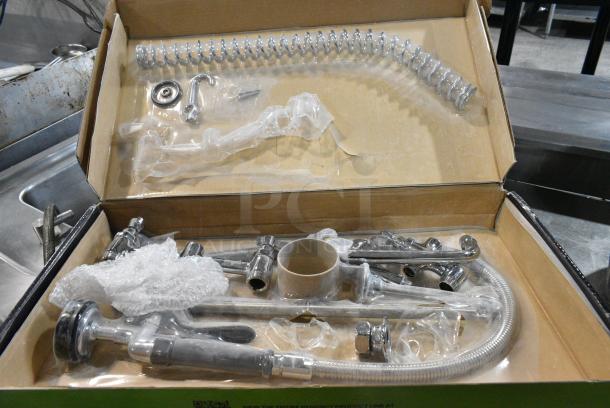 BRAND NEW SCRATCH AND DENT! Regency 600PRD8X 1.15 GPM Deck-Mounted Pre-Rinse Faucet with 8" Centers and 8" Add-On Faucet - Image 1 of 5