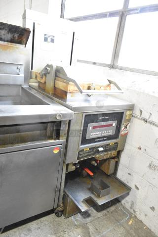 2019 Henny Penny PFG-691 Stainless Steel Commercial Floor Style Propane Gas Powered Pressure Fryer. 100,000 BTU.