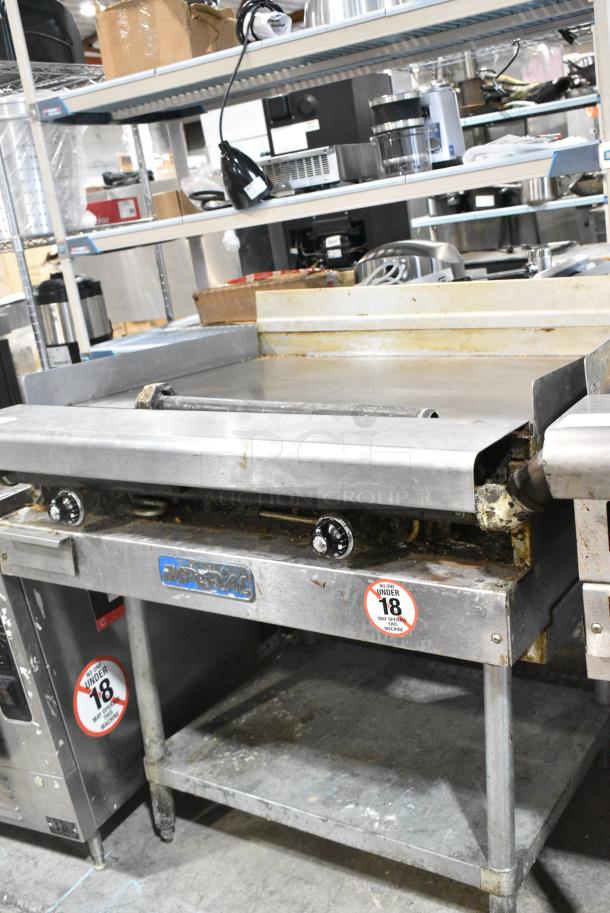 Imperial Stainless Steel Commercial Natural Gas Powered Flat Top Griddle w/ Metal Under Shelf. - Image 1 of 10