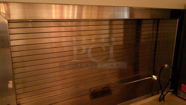 (1) STAINLESS HEATED MOBILE PLATE DISPENSER (2) MOBILE DISH DISPENSERS  
(1) LOCKING ROLL UP SHUTTER WINDOW 54"x 3 ' - Image 6 of 6