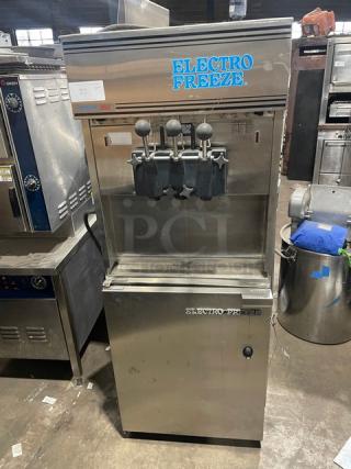Electro-Freeze Freedom 360 Series Commercial Stainless Steel Air-Cooled Dual Flavor Twist Soft Serve Ice Cream/Frozen Yogurt Machine! With 2 Hoppers & 3 Dispensers! Model: 88TN-CMT-213 SN: A2F105! 230V 1 Phase! On Legs!