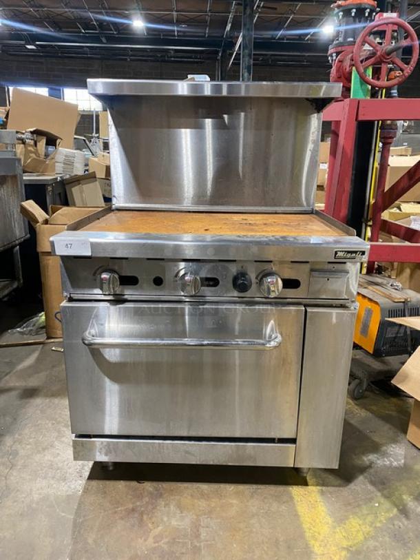 Migali Commercial Stainless Steel Natural Gas Powered Flat Griddle Range/Oven Combo! With Back Splash & Overhead Salamander Shelf! With Wire Oven Racks! On Legs! - Image 1 of 11